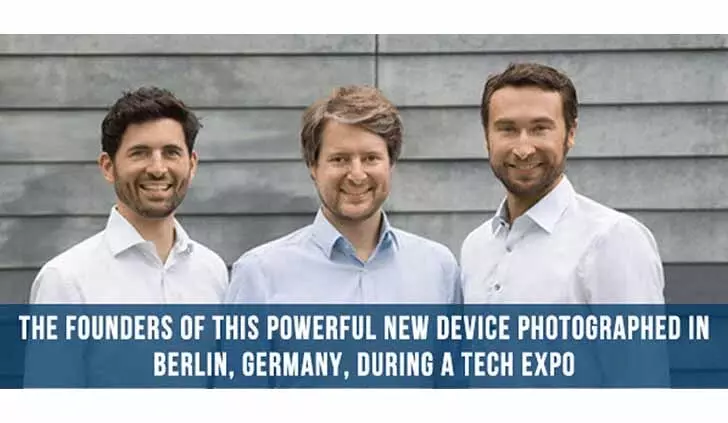Seller advertising photo labeling three men as device founders at a Berlin tech expo